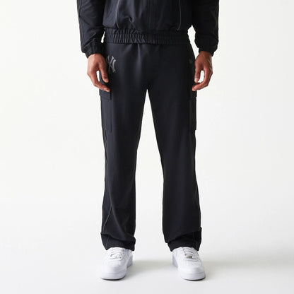 The model is wearing this MLB Utility New York Yankees Straight Leg Cargo Joggers in black. 3