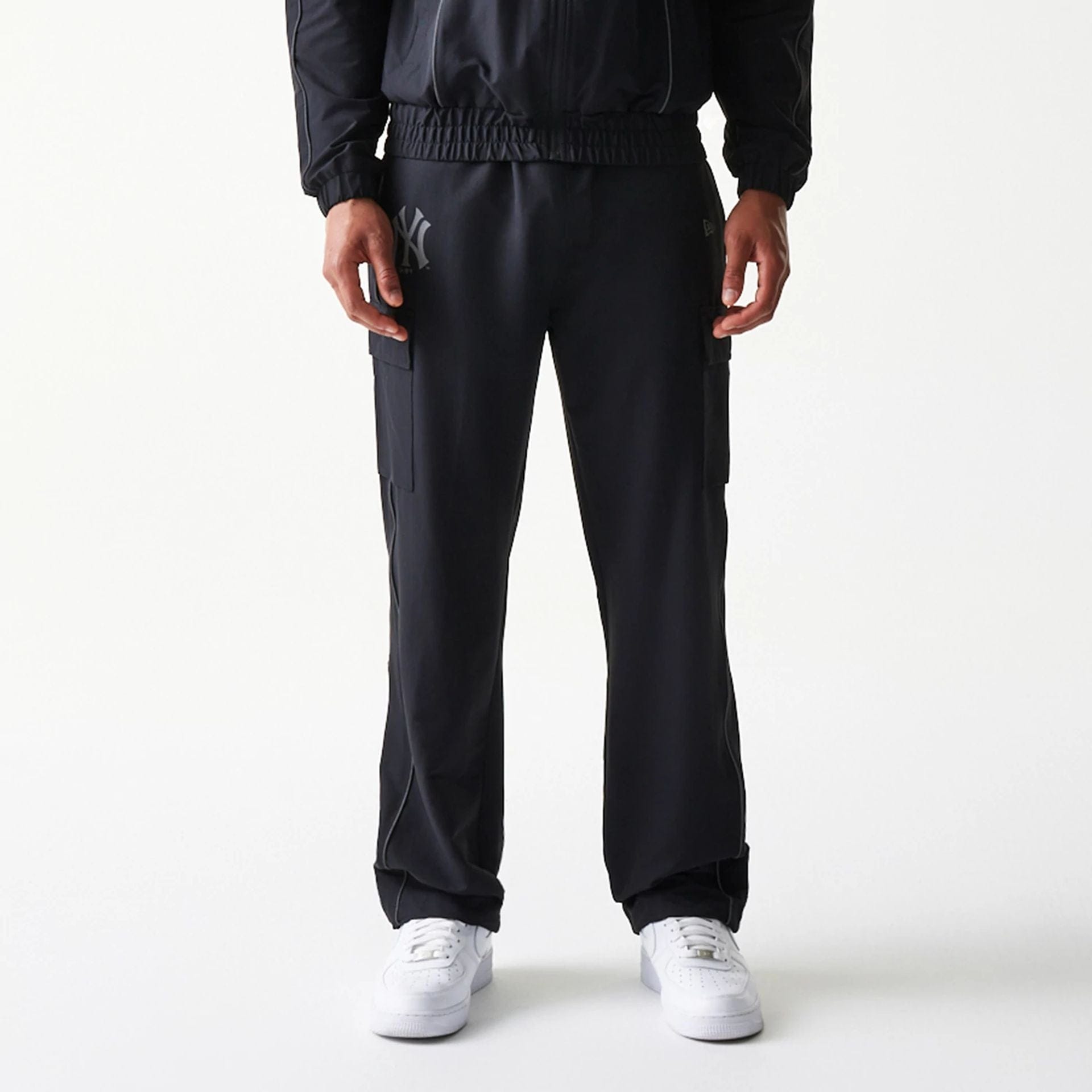 The model is wearing this MLB Utility New York Yankees Straight Leg Cargo Joggers in black. 3