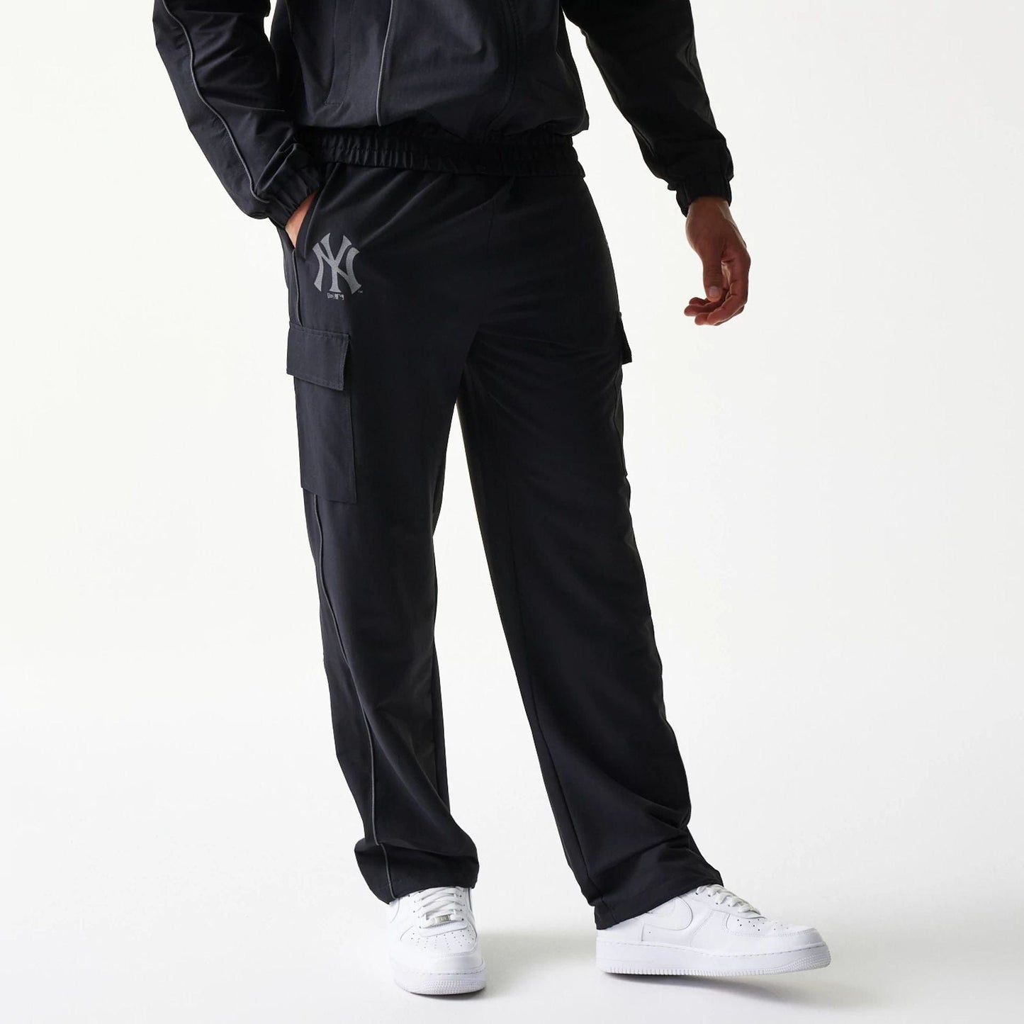 The model is wearing this MLB Utility New York Yankees Straight Leg Cargo Joggers in black. 1