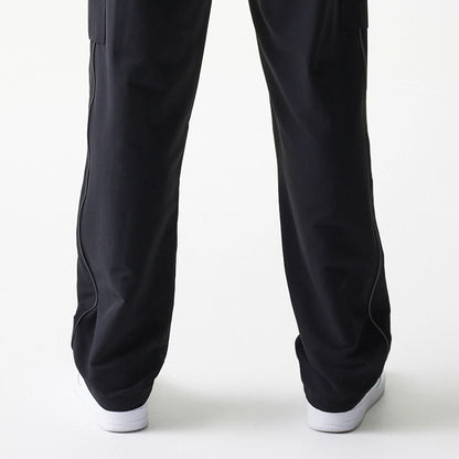 The model is wearing this MLB Utility New York Yankees Straight Leg Cargo Joggers in black. 7
