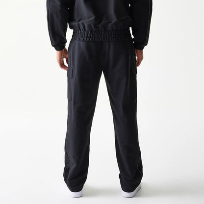The model is wearing this MLB Utility New York Yankees Straight Leg Cargo Joggers in black. 2