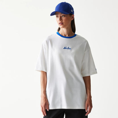 The model is wearing this New Era Script Oversized T-Shirt in white. 4