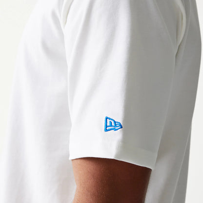 New Era Script White Oversized T-Shirt, side view showing the short sleeve with a blue embroidered New Era logo near the hem, highlighting the classic white design on a model's upper arm.