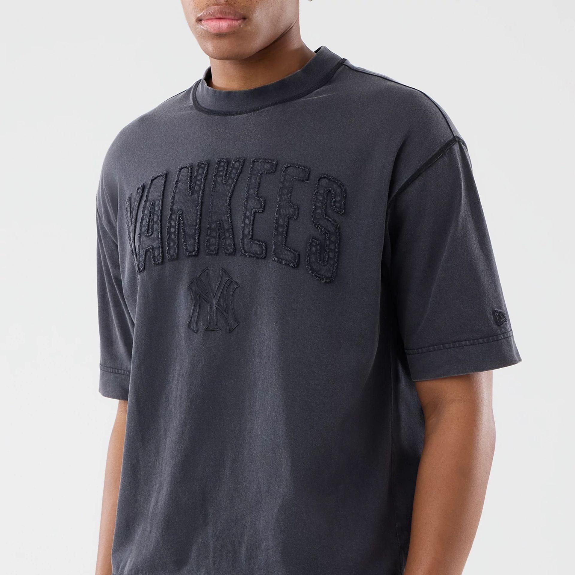 The model is wearing this MLB Washed New York Yankees T-Shirt in black. 3