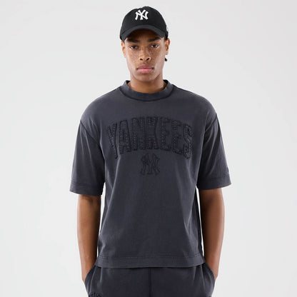 The model is wearing this MLB Washed New York Yankees T-Shirt in black. 1