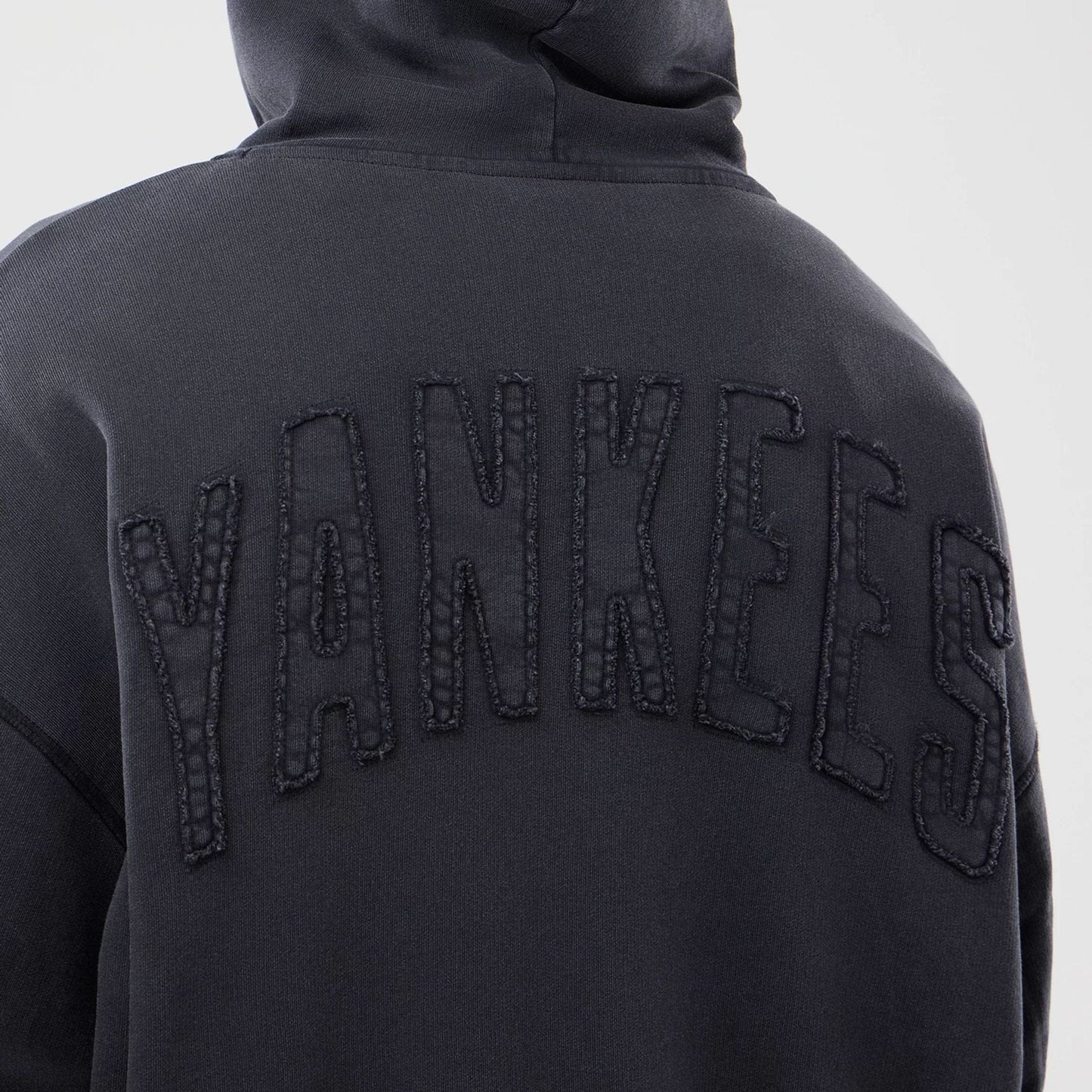 The model is wearing this MLB Washed New York Yankees Full Zip Hoodie in black. 7