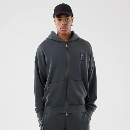New Era LA Dodgers MLB Washed Dark Grey Full Zip Hoodie, front view showing the dark grey zip closure down the centre, raised LA logo on the left chest, on-model with a plain black cap worn for styling.