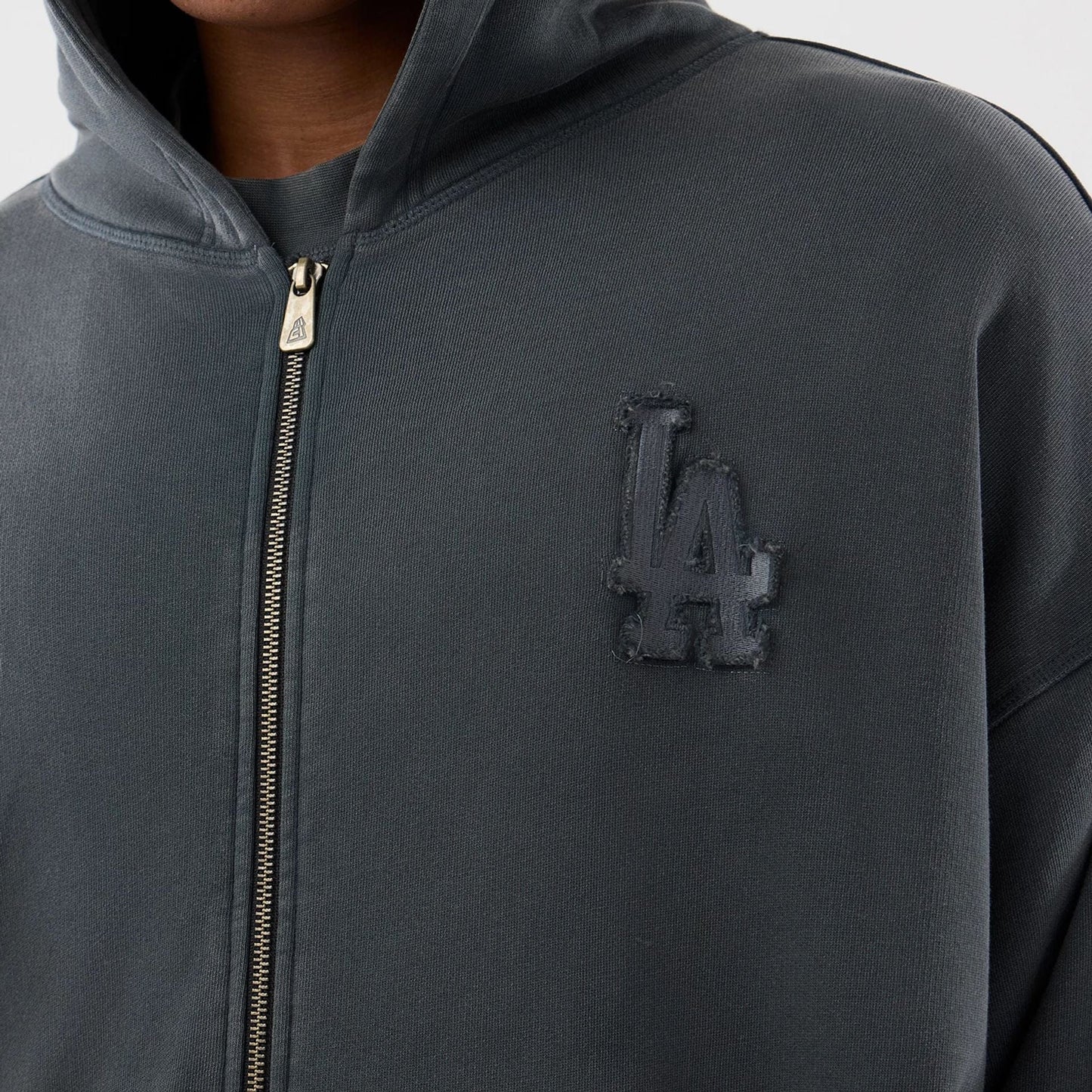 The model is wearing this MLB Washed LA Dodgers Full Zip Hoodie in Dark Grey. 6