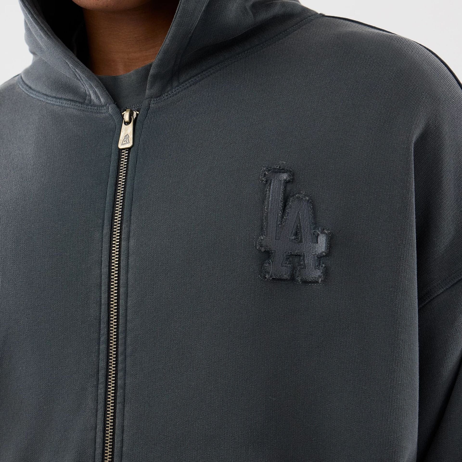 The model is wearing this MLB Washed LA Dodgers Full Zip Hoodie in Dark Grey. 6