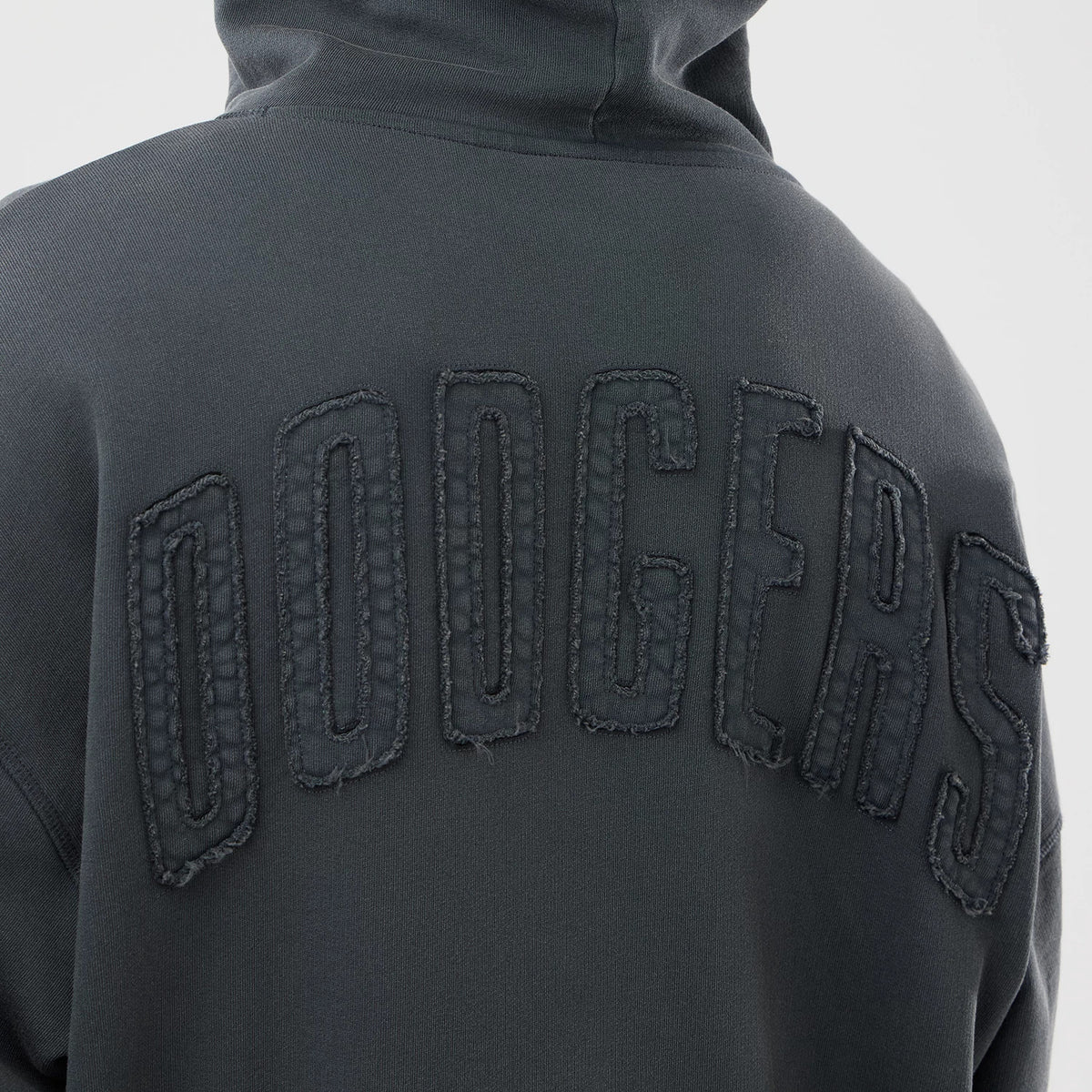 New Era LA Dodgers MLB Washed Dark Grey Full Zip Hoodie, back view showing the word DODGERS in large raised lettering across the shoulders on a dark grey fabric, with a hood at the top.