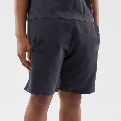 The model is wearing this MLB Washed New York Yankees Shorts in black. 5