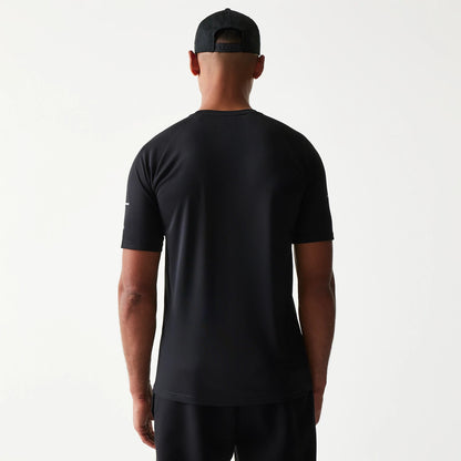 New Era New York Yankees MLB Reflective Black T-Shirt, back view on-model highlighting the plain black back panel, short sleeves and reflective on the sleeve, paired with a black cap.