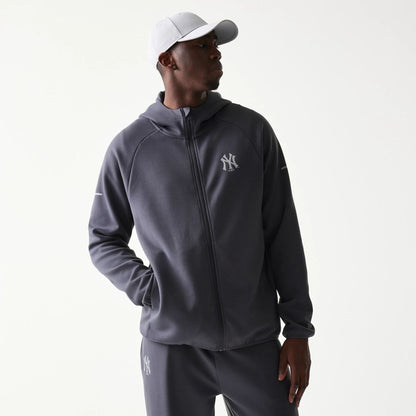 The model is wearing this MLB New York Yankees Full Zip Hoodie in dark grey. 1