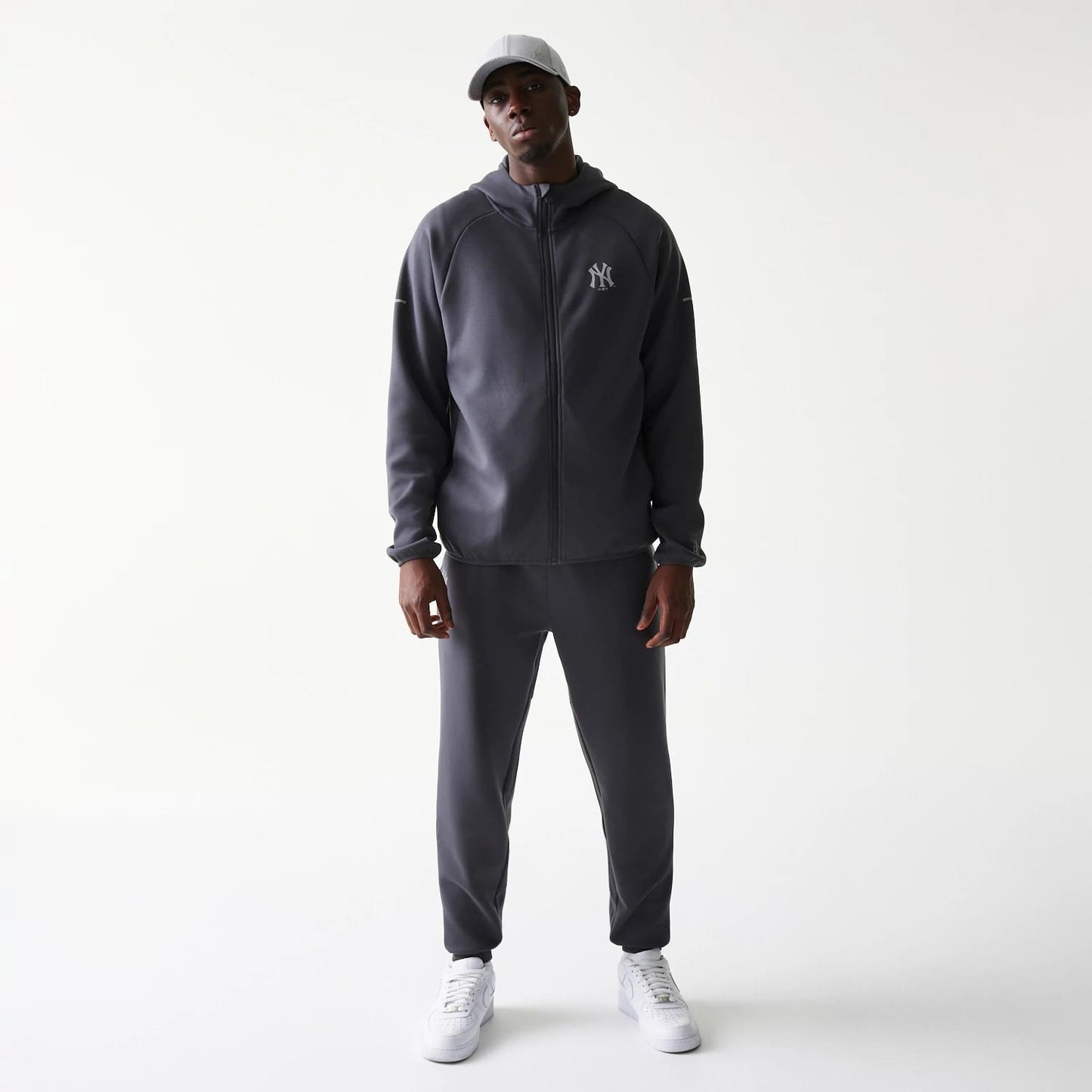 The model is wearing this MLB New York Yankees Full Zip Hoodie in dark grey. 8