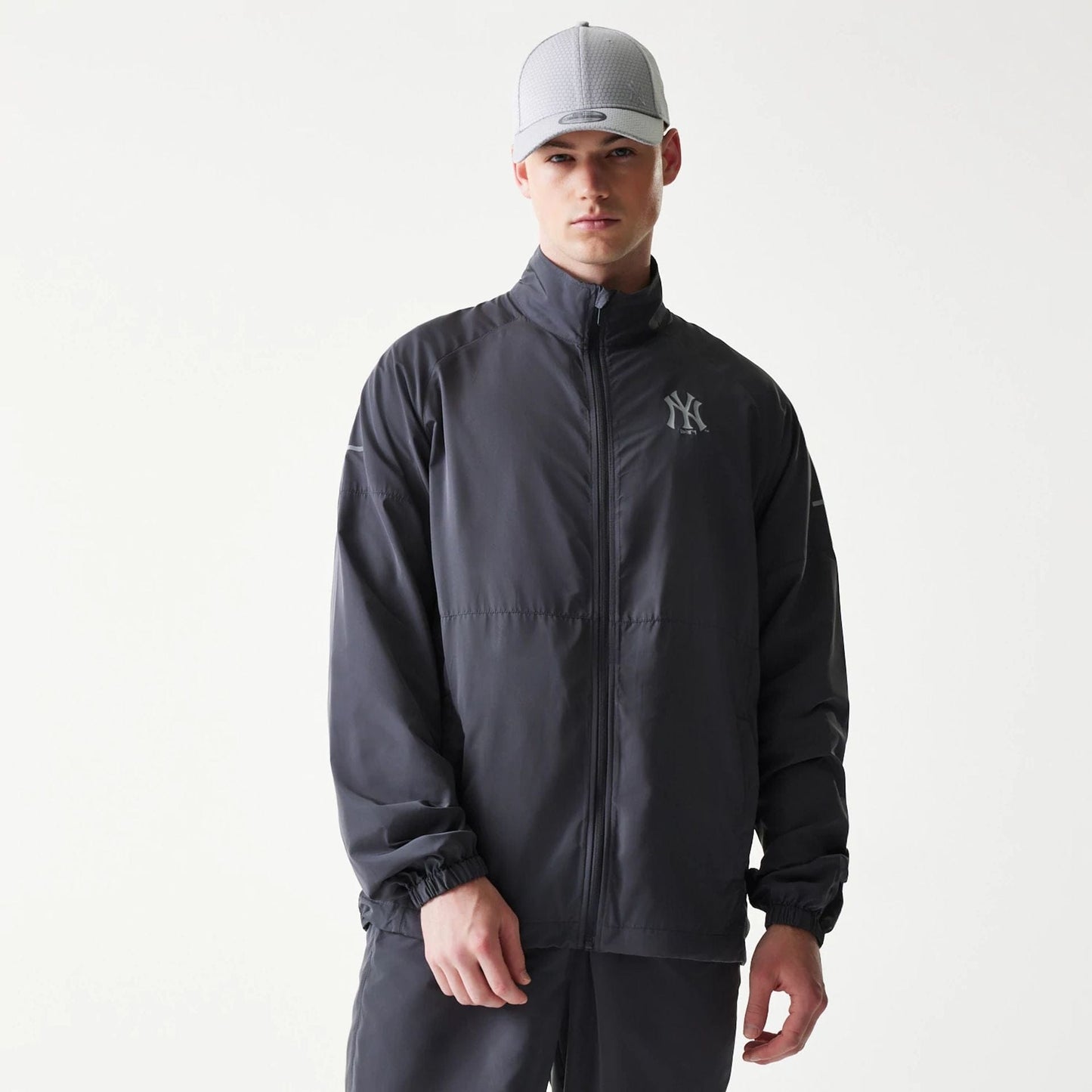 The model is wearing this MLB New York Yankees Jacket in dark grey. 1