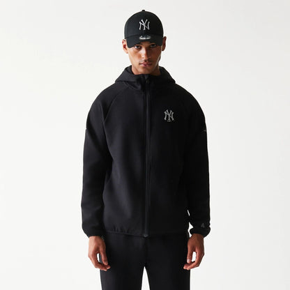 The model is wearing this MLB New York Yankees Full Zip Hoodie in black. 3