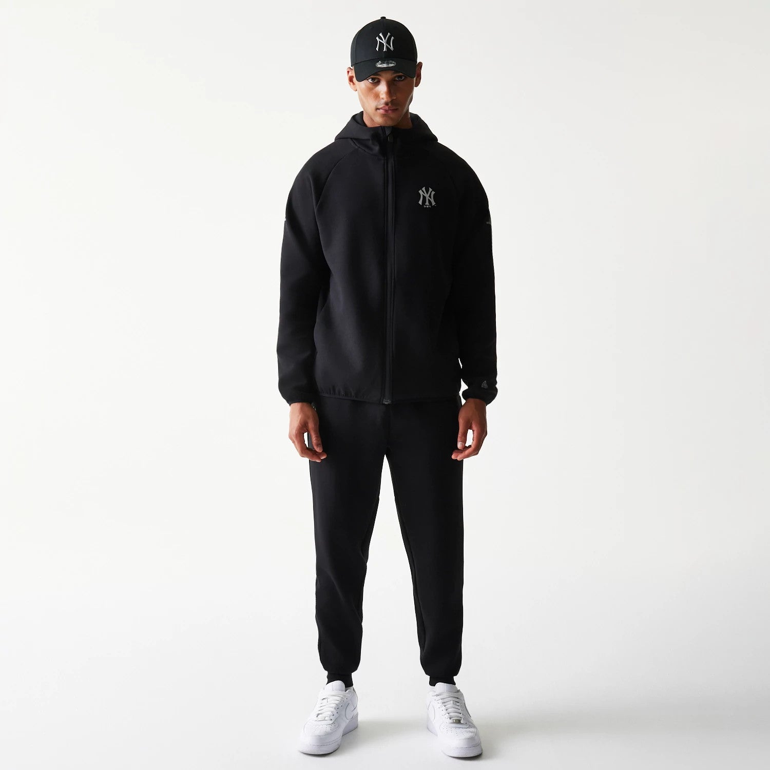 The model is wearing this MLB New York Yankees Full Zip Hoodie in black. 8