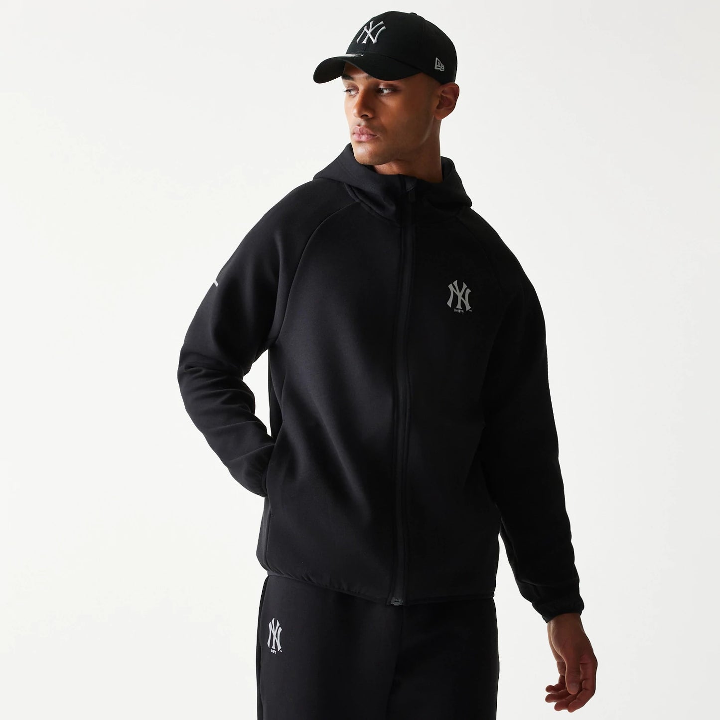 The model is wearing this MLB New York Yankees Full Zip Hoodie in black. 1