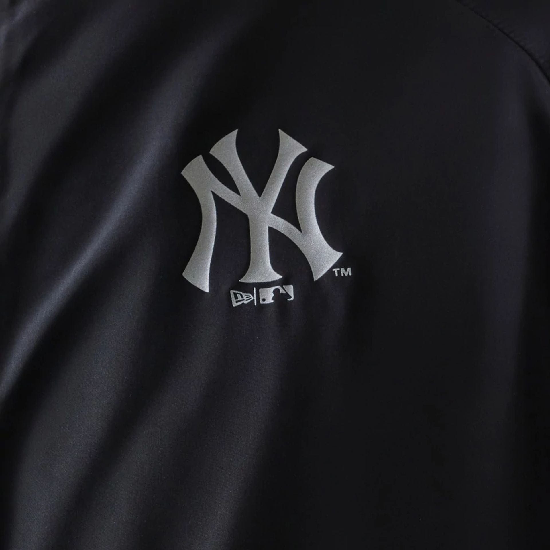 The model is wearing this MLB New York Yankees Jacket in black. 5