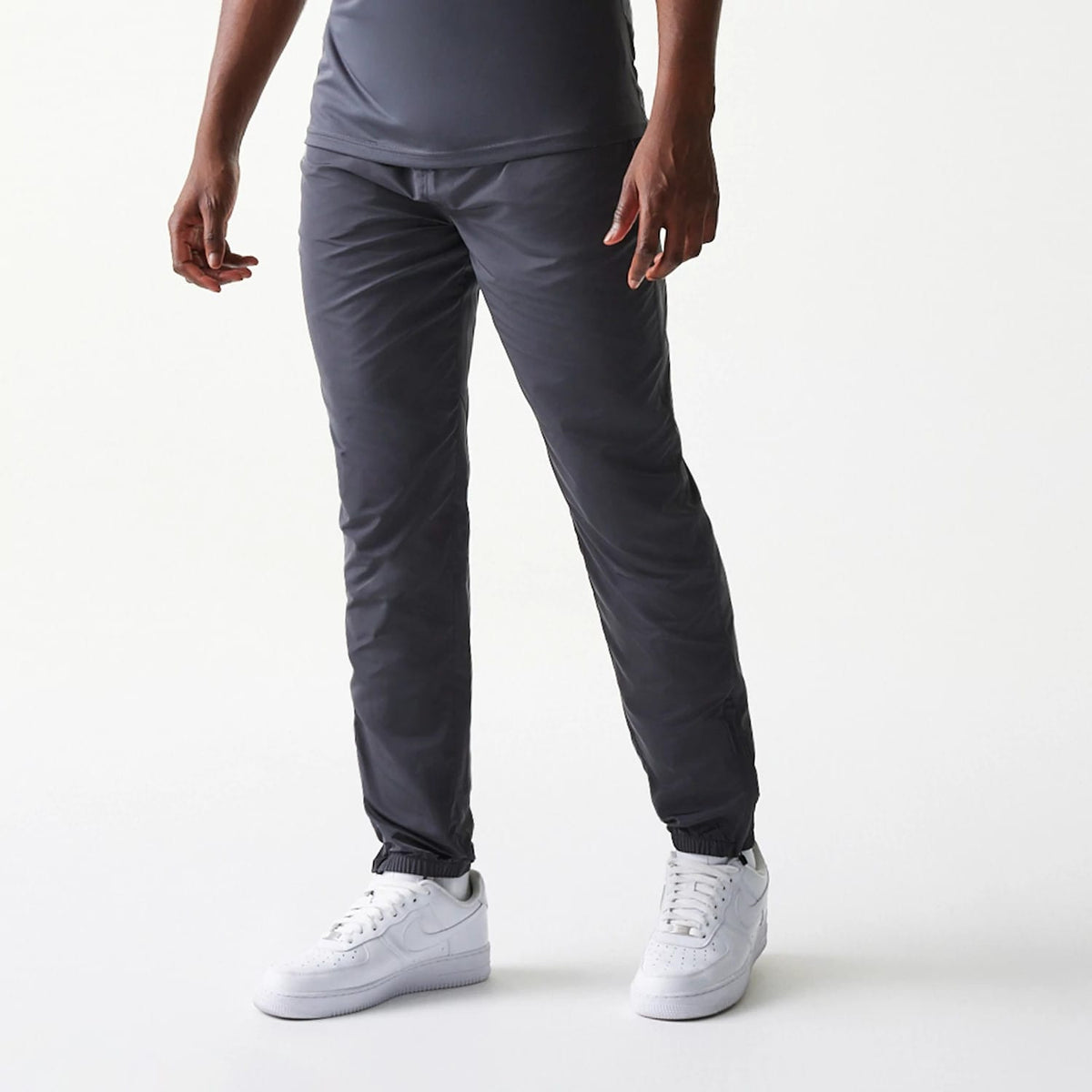 The model is wearing this MLB New York Yankees Track Pants in dark grey. 3