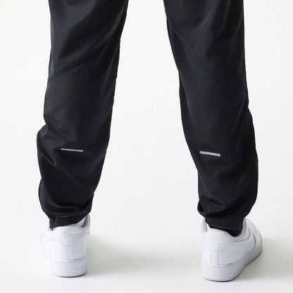 The model is wearing this MLB New York Yankees Track Pants in black. 5