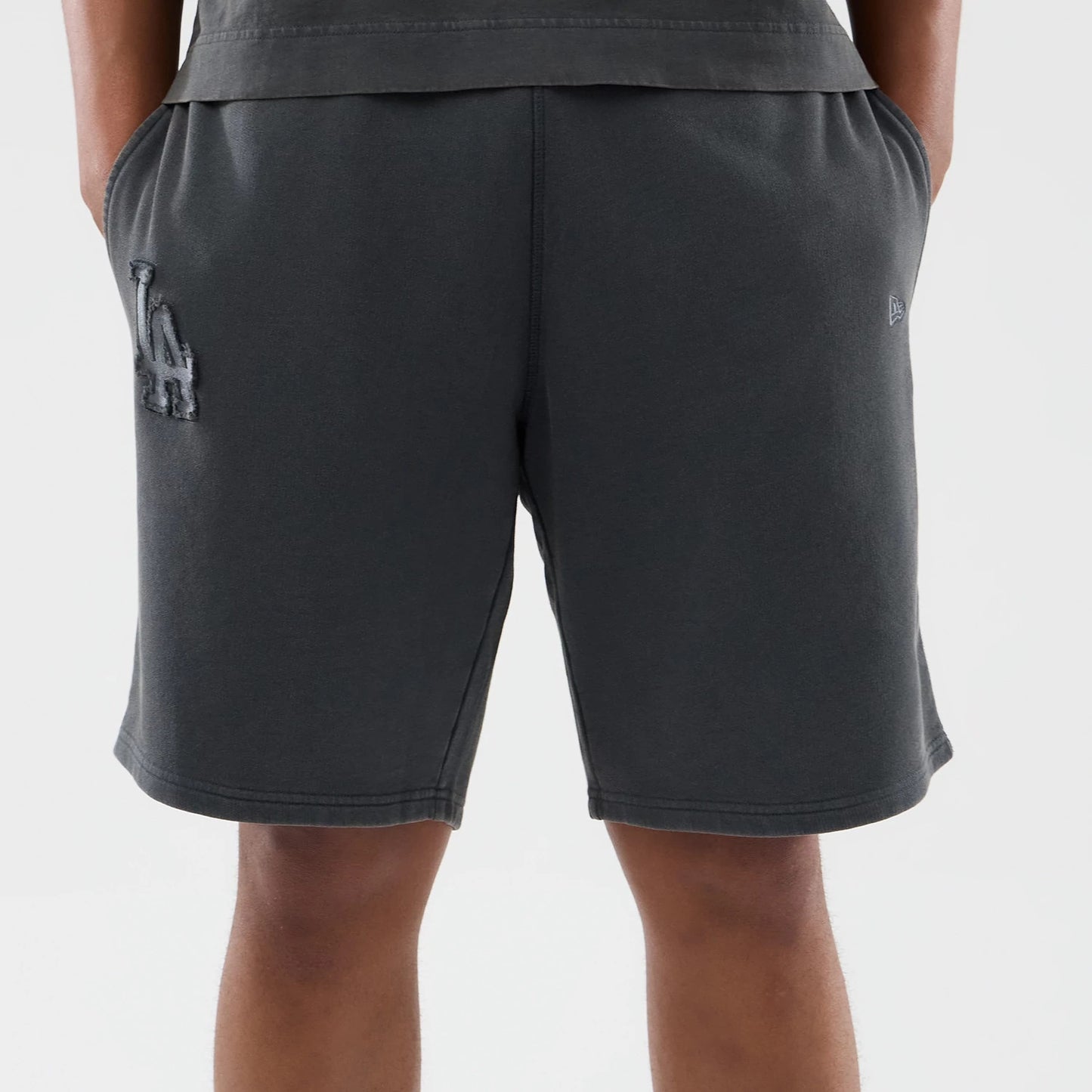 The model is wearing this MLB Washed LA Dodgers Shorts in Dark Grey. 5