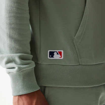 The model is wearing this MLB League Essential Midi LA Dodgers Oversized Pullover Hoodie in pastel green. 6
