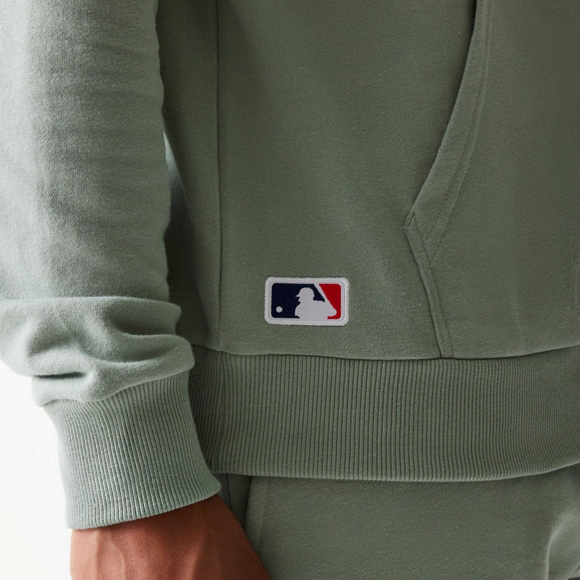 The model is wearing this MLB League Essential Midi LA Dodgers Oversized Pullover Hoodie in pastel green. 6