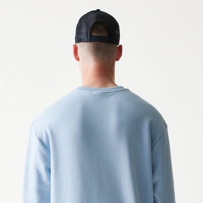 The model is wearing this MLB League Essential Midi New York Yankees Oversized Crew Neck Sweater in pastel blue. 7