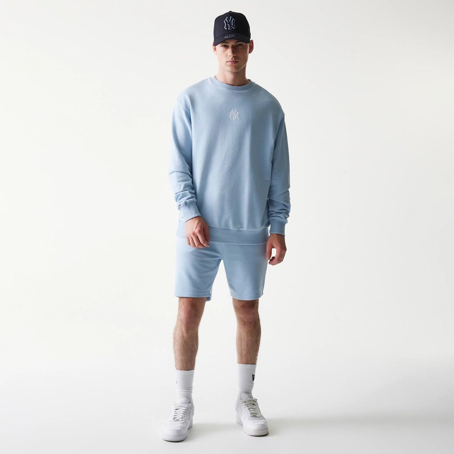 The model is wearing this MLB League Essential Midi New York Yankees Oversized Crew Neck Sweater in pastel blue. 8