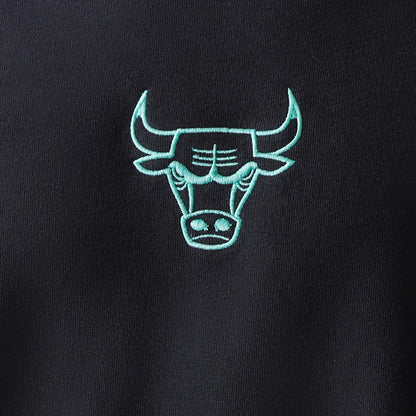 New Era Chicago Bulls NBA Black Oversized Crew Neck Sweater, close-up showing a mint green embroidered Bulls logo centred on the chest, set against a black fabric for contrast and style.