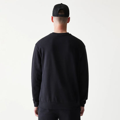 The model is wearing this NBA League Essential Chicago Bulls Oversized Crew Neck Sweater in black. 2