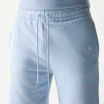 New Era New York Yankees MLB League Essential Midi Blue Shorts, front view showing a drawstring waist, the embroidered New Era logo on the right thigh and the NY Yankees logo on the left thigh.