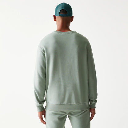 The model is wearing this MLB League Essential Midi LA Dodgers Oversized Crew Neck Sweater in green. 2
