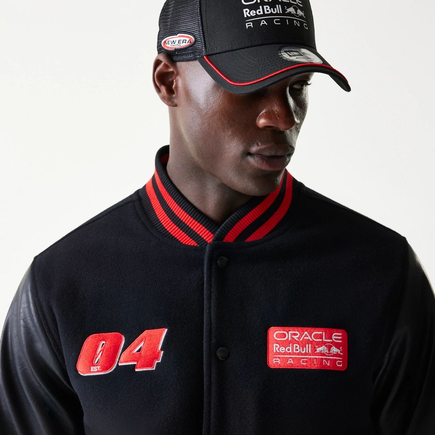 The model is wearing this Red Bull Racing Varsity Jacket in black. 4