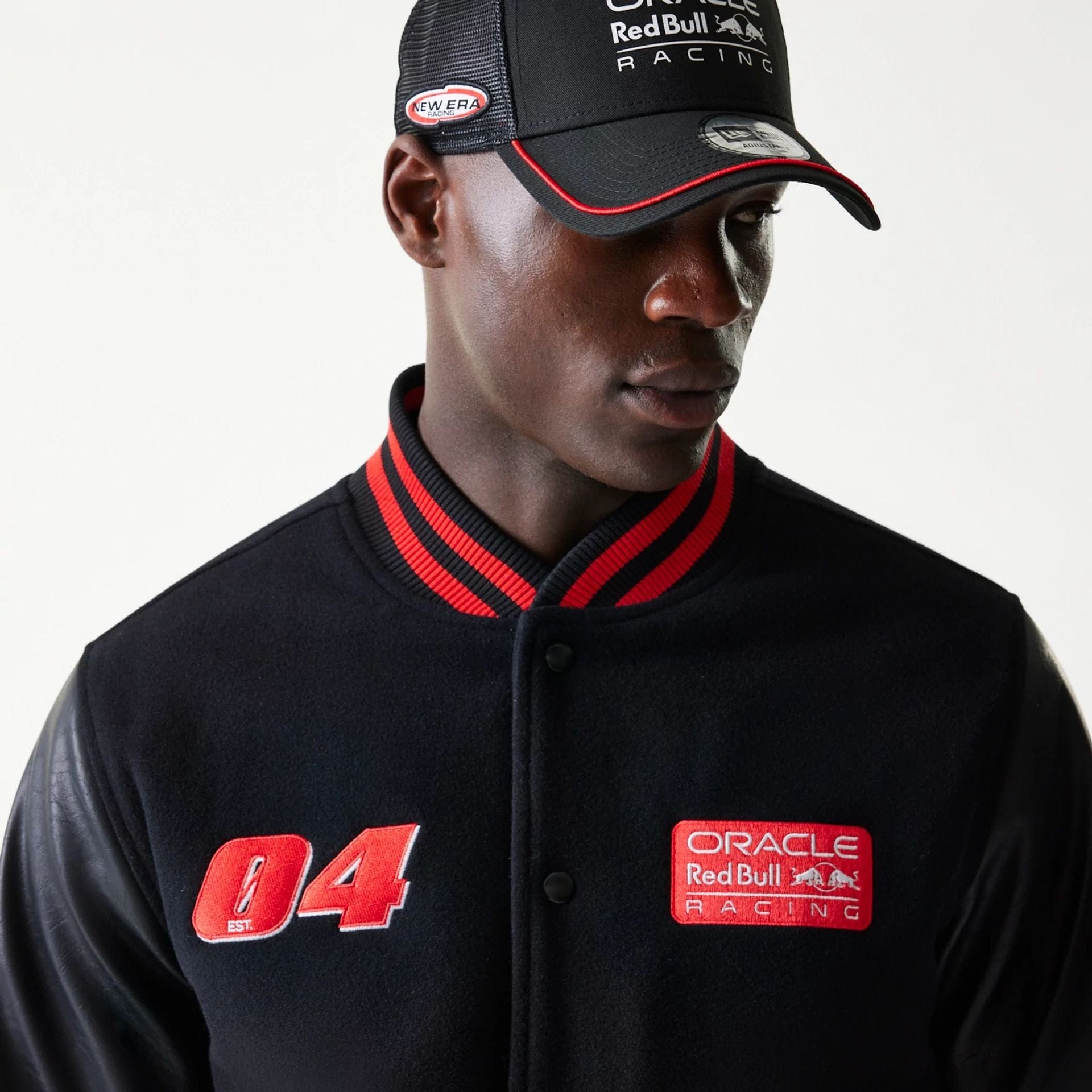 The model is wearing this Red Bull Racing Varsity Jacket in black. 4