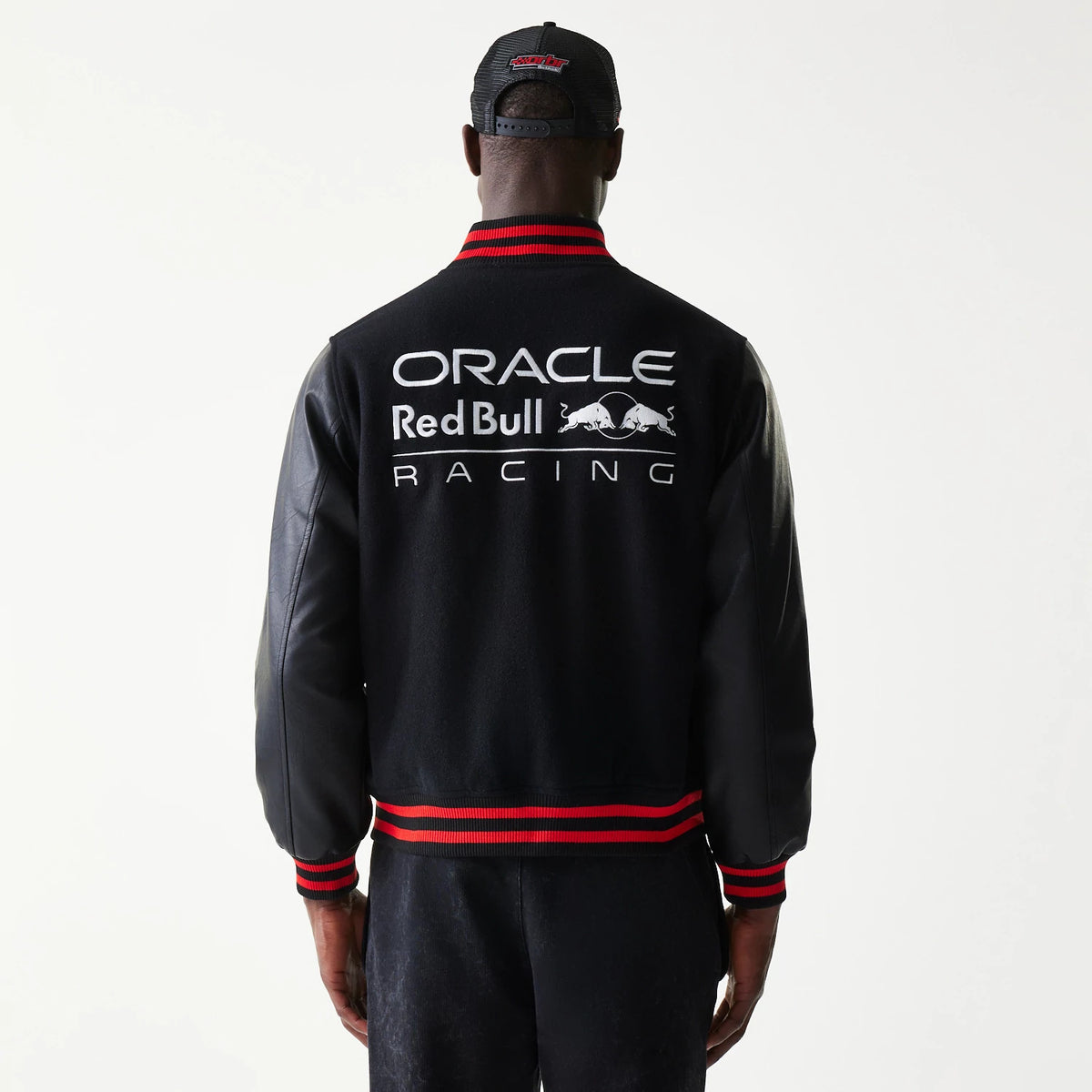 The model is wearing this Red Bull Racing Varsity Jacket in black. 2