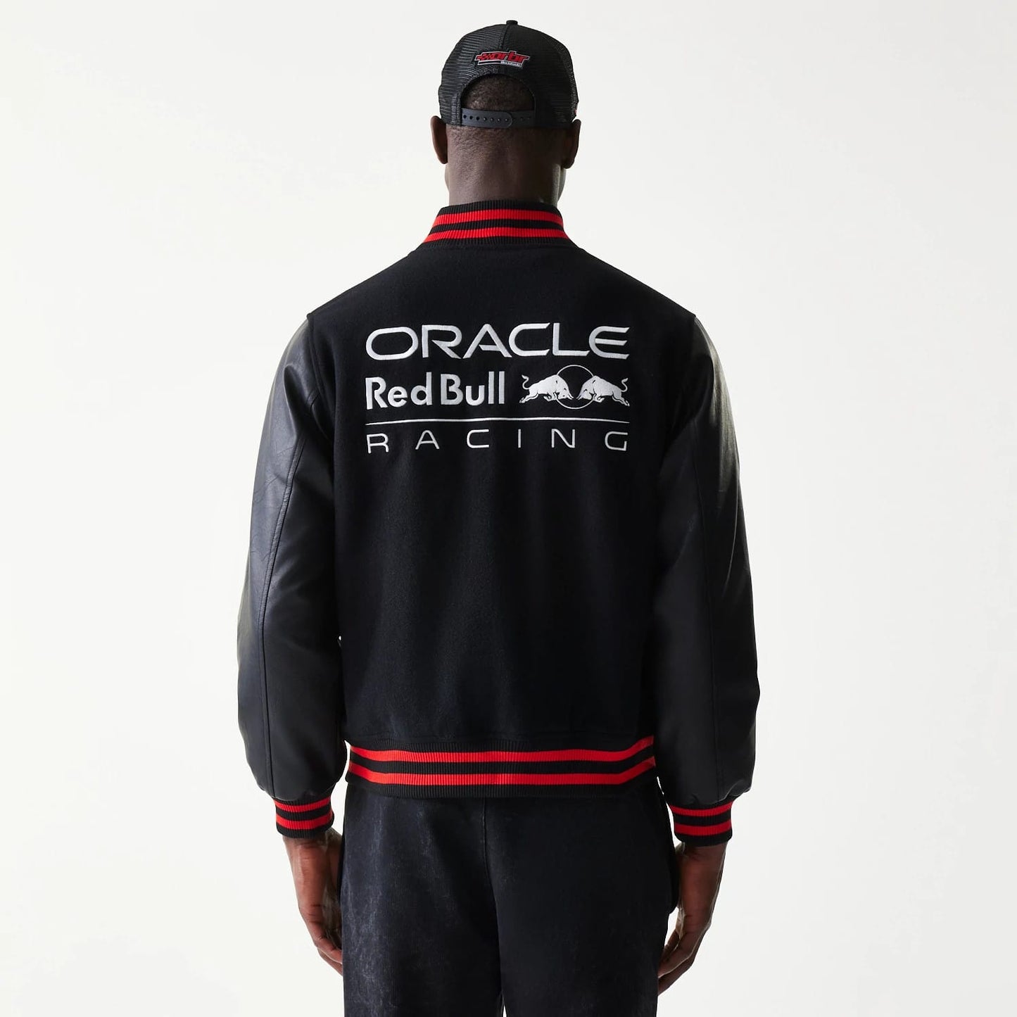 The model is wearing this Red Bull Racing Varsity Jacket in black. 2