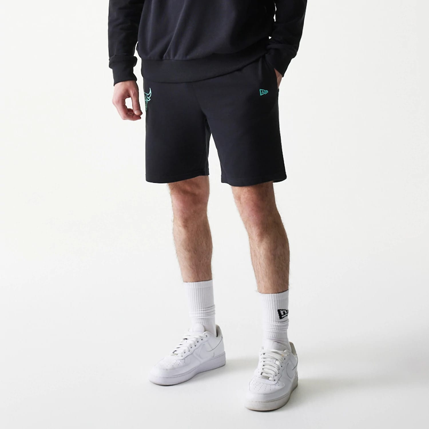 The model is wearing this NBA Core Chicago Bulls Shorts in black. 7