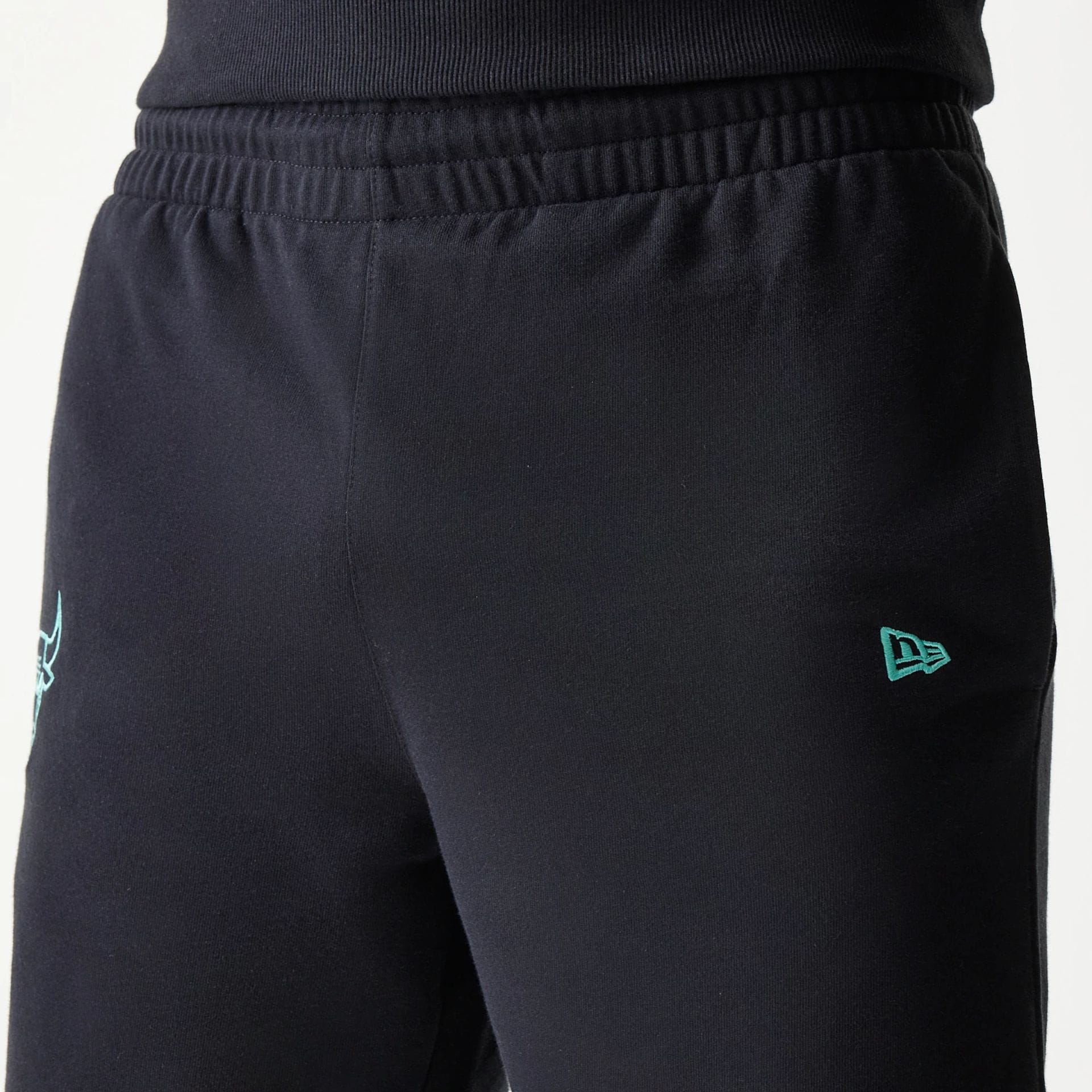 The model is wearing this NBA League Essential Chicago Bulls Shorts in black. 5