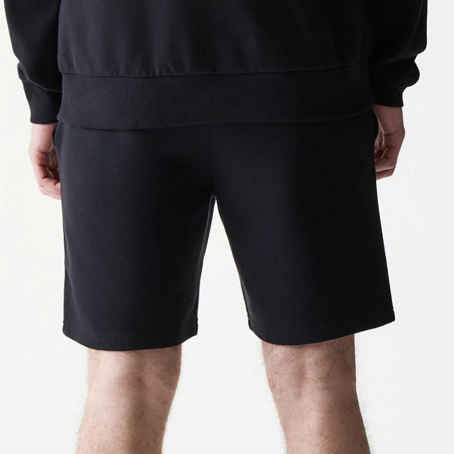 The model is wearing this NBA League Essential Chicago Bulls Shorts in black. 6