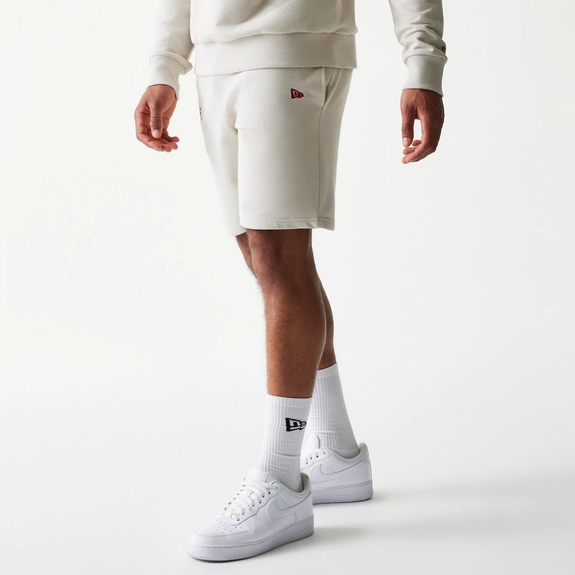 The model is wearing this NBA League Essential LA Lakers Shorts in light beige. 1