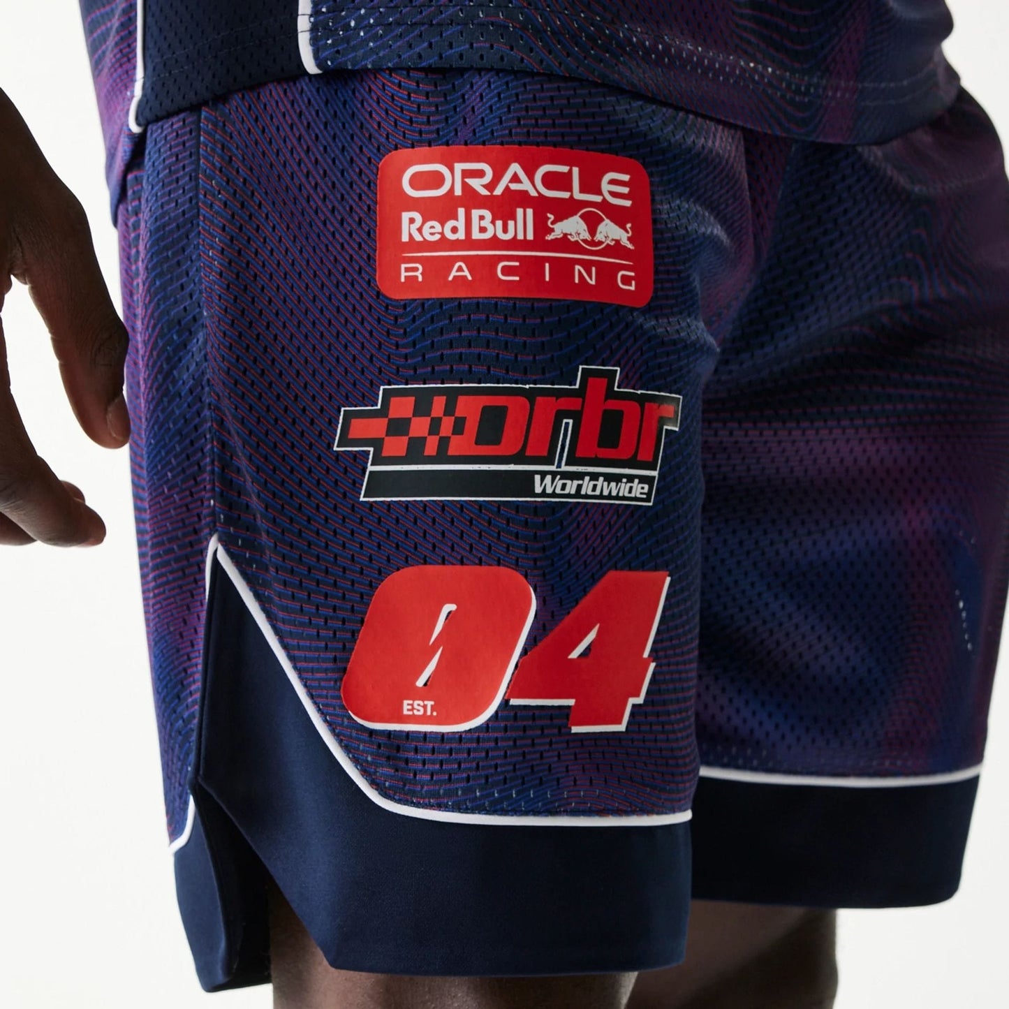 The model is wearing this Red Bull Racing Oversized Mesh Shorts in dark blue. 3