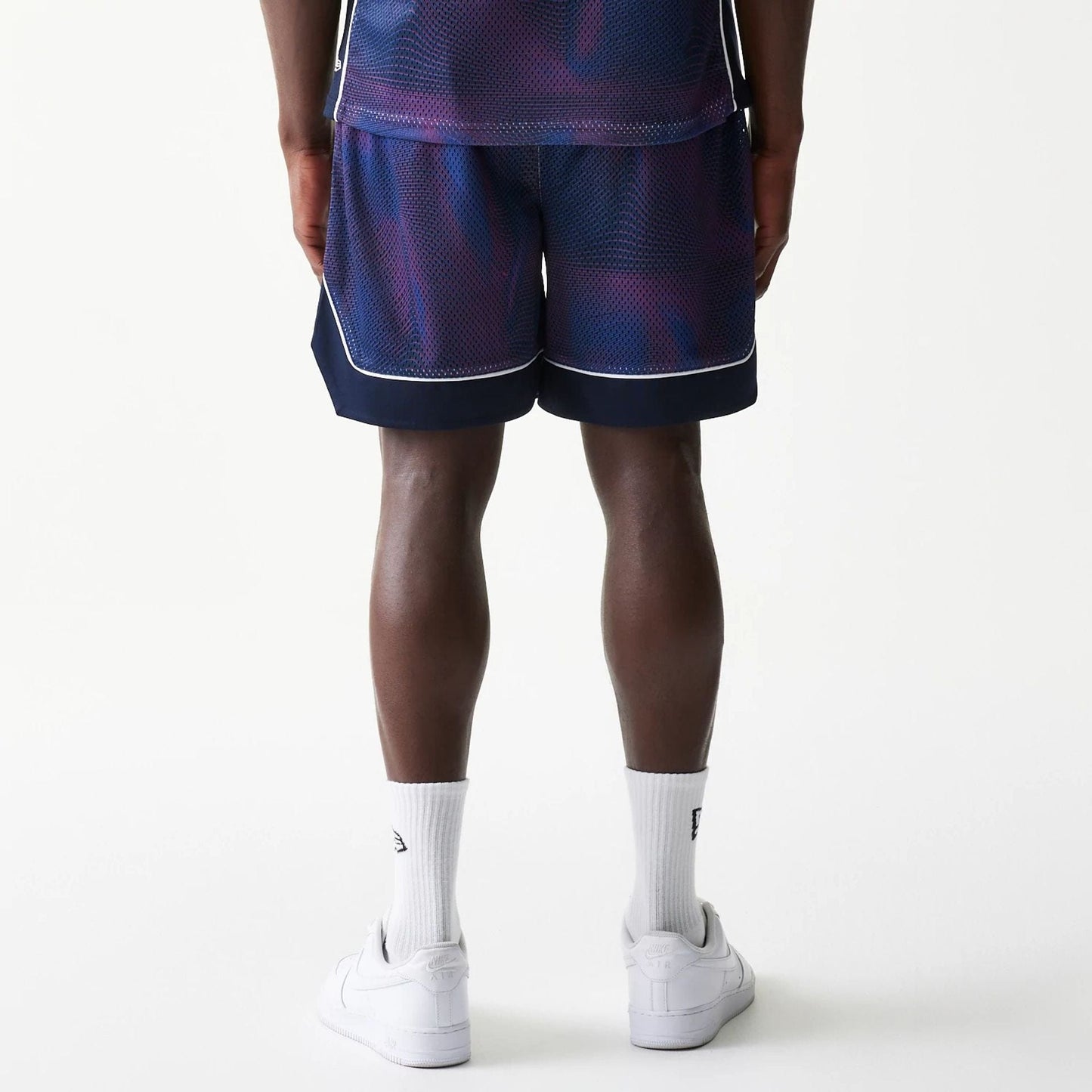 The model is wearing this Red Bull Racing Oversized Mesh Shorts in dark blue. 2