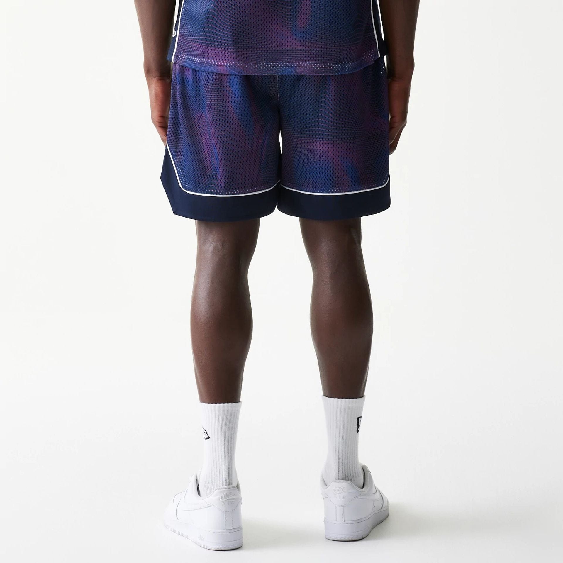 The model is wearing this Red Bull Racing Oversized Mesh Shorts in dark blue. 2