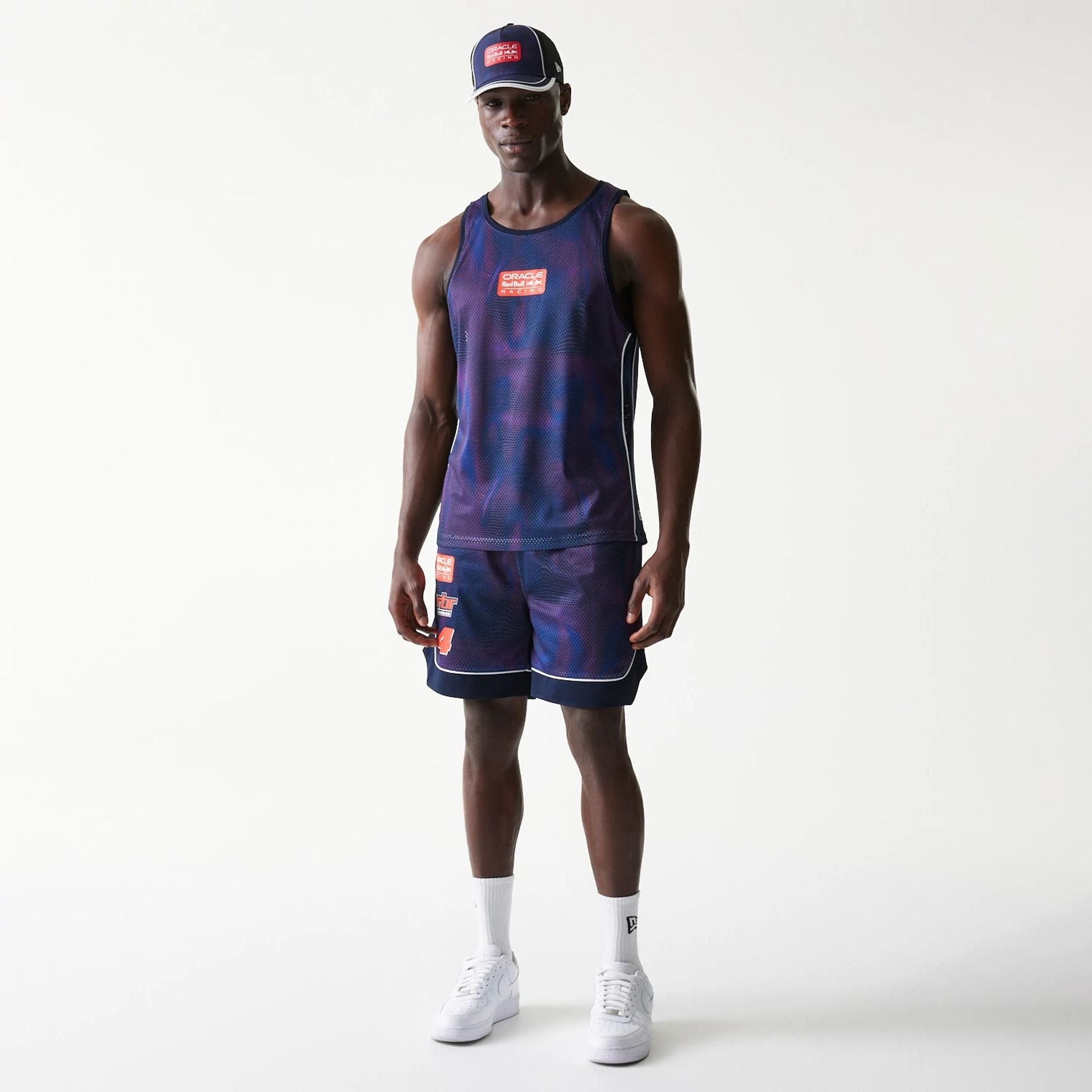 The model is wearing this Red Bull Racing Oversized Mesh Shorts in dark blue. 8