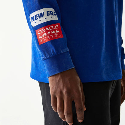 The model is wearing this Red Bull Racing Linear Graphic Long Sleeve T-Shirt in blue. 5