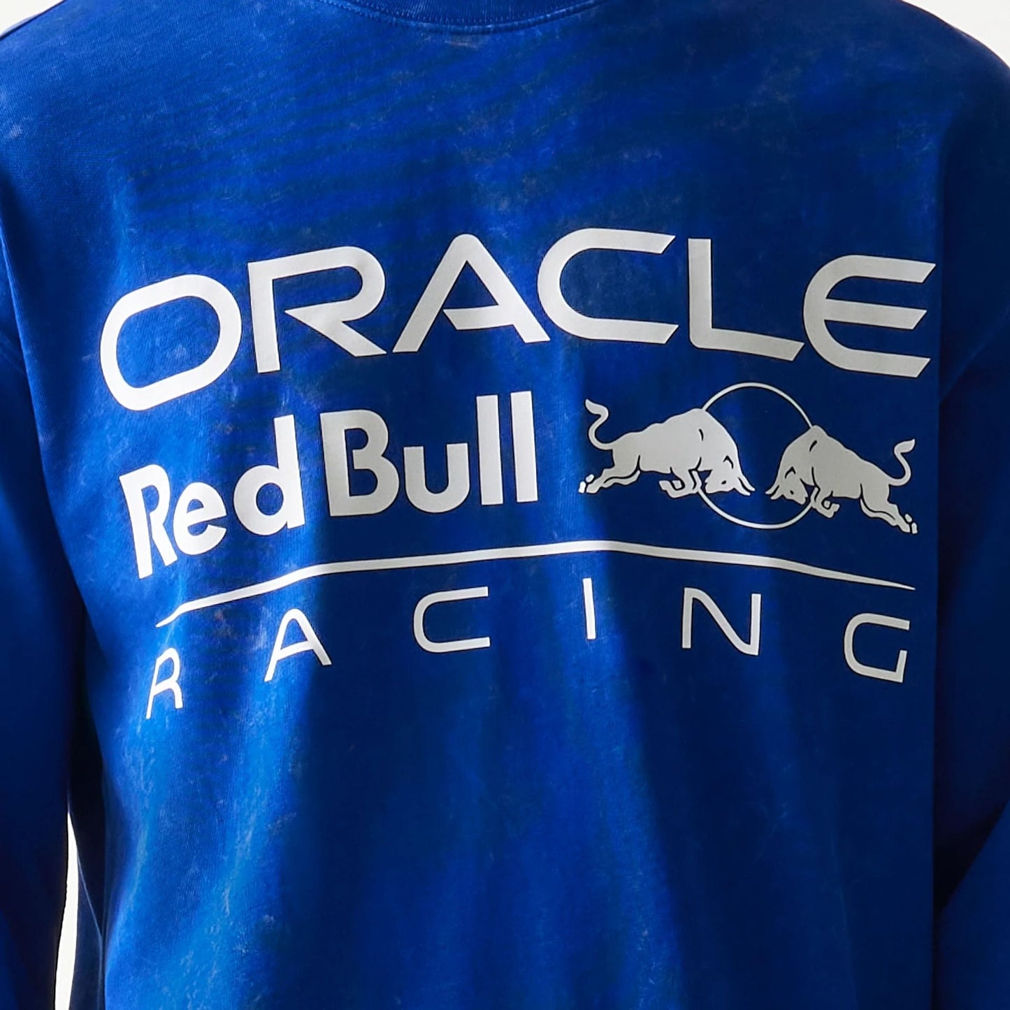 The model is wearing this Red Bull Racing Linear Graphic Long Sleeve T-Shirt in blue. 6