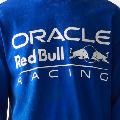 The model is wearing this Red Bull Racing Linear Graphic Long Sleeve T-Shirt in blue. 6