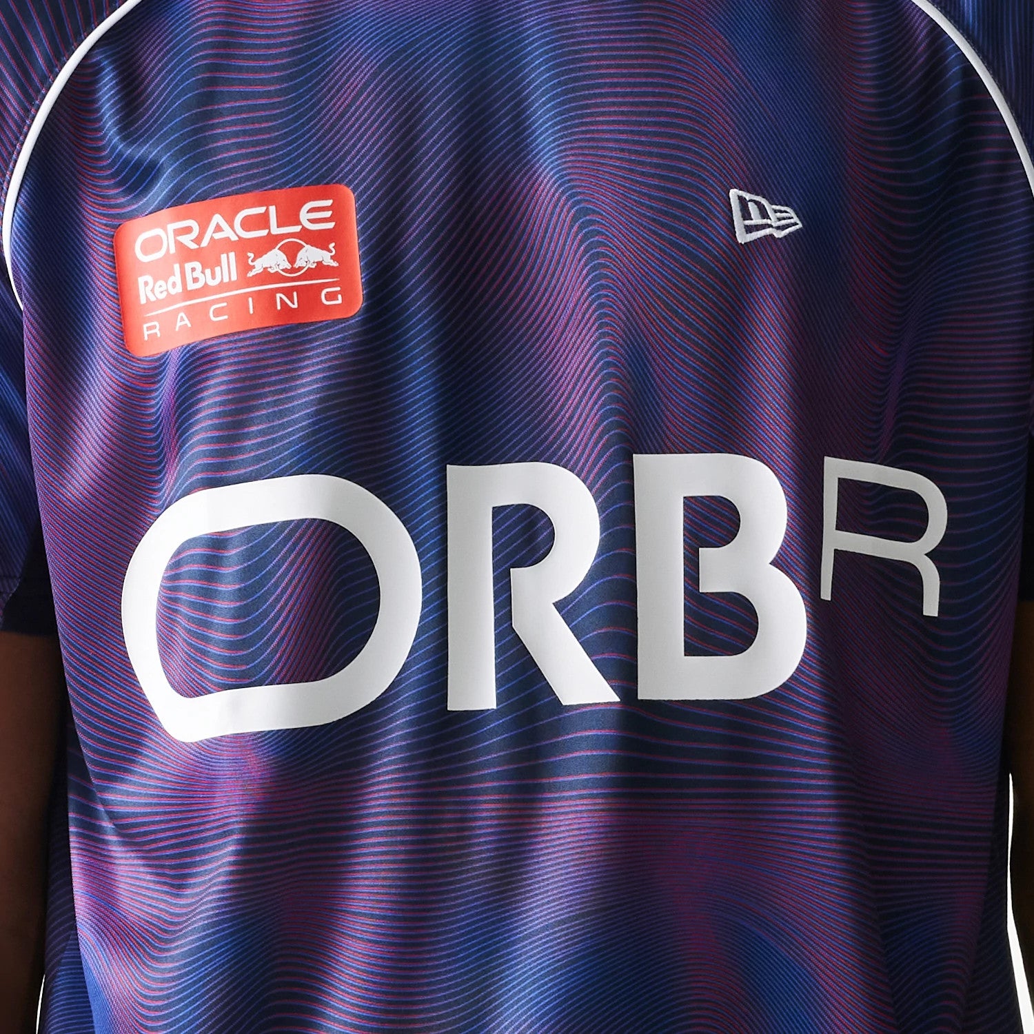 The model is wearing this Red Bull Racing All Over Print Football T-Shirt in dark blue. 3